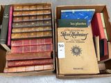 many old books in a box on the floor