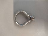 a silver ring with a ball on top of it