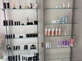 two shelves with different types of hair products on them