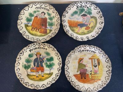 four plates with a picture of a man and a woman on them