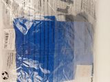 a plastic bag with a blue object inside of it