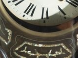 a close up of a clock with roman numerals on it