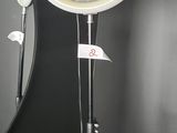 a black wall with a mirror and a light on it