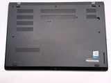 a black laptop that is sitting on a white table