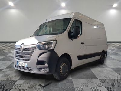 a white van that is parked on a checkered floor