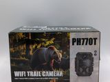 a box with a camera inside of it on a white surface