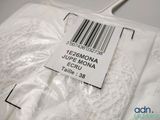 a label on the back of a white shirt