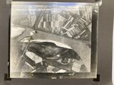 a picture of an old picture of a man on a motorcycle