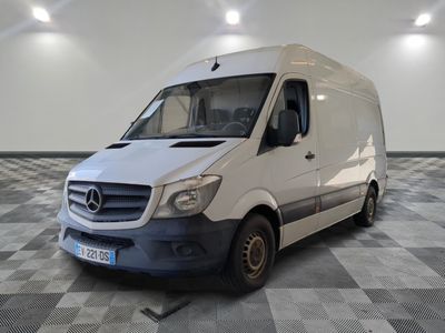 a white van parked in a room with checkered flooring