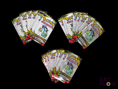 four packs of pokemon trading cards on a black background