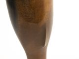 a vase that is sitting on a white surface