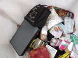 a bag full of items sitting on top of a bed