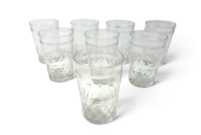 six glasses of water sitting next to each other on a white surface