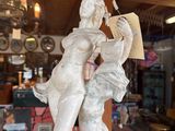 a statue that is sitting on a table in a store