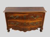 an image of a wooden chest of drawers with brass handles