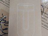 a box of nespresso travel mugs on a table