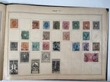 an open book with a lot of different stamps on it