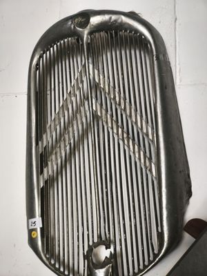an image of a close up of a metal grill on a wall