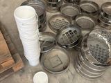 a pile of metal pots and pans sitting on the floor