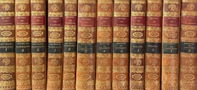 many books that are lined up on a shelf