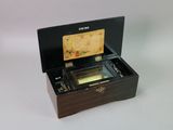 a wooden box with a music box inside of it