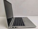 an open laptop computer sitting on top of a white table