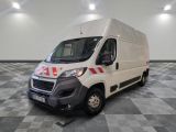 a picture of a white van parked in a large room