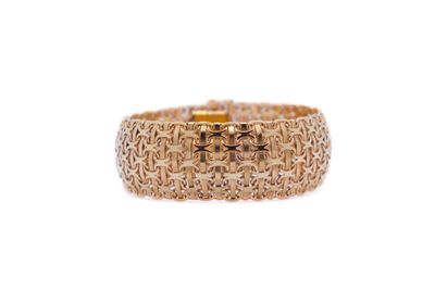 a close up of a gold ring on a white background