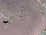 a close up of a metal object with a hole in it
