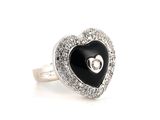 black and white heart shaped ring with diamond accents on a white background