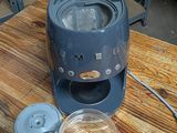 a small blender sitting on a wooden table