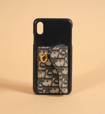 iphone case with a phone holder and a keychain on a beige background