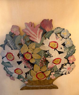a picture of a vase of flowers on the wall