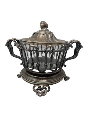 an image of a silver plate with a glass bowl on it