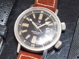 a watch that is sitting on top of a piece of leather