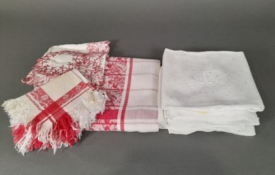 several towels and napkins are laid out on a table