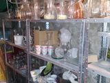 a room filled with lots of glassware and other items