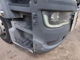 a close up of the front of a truck with the door open