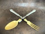 two forks and two spoons on the table