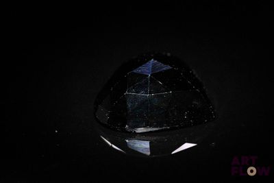 an image of a black diamond in the dark