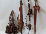 several different types of weapons are displayed on a white surface