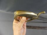 a person holding a very large knife in their hand