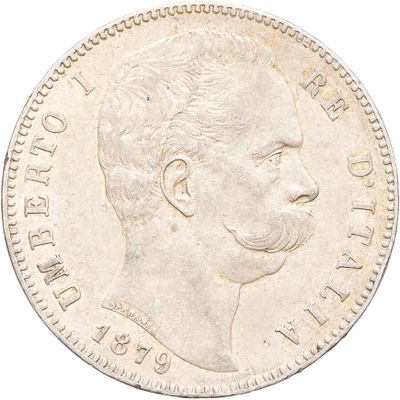 a close up of a coin with a man ' s face on it