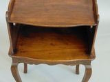 an image of a small wooden table with a shelf on top