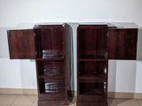 two wooden cabinets in the corner of a room