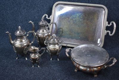 a silver tray with a silver tea pot and a silver tray with a silver tray and a silver tray with a silver tray and a silver tray with a