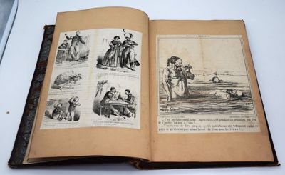 un vieux livre avec des illustrations représentant des personnes et des animaux