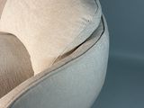 a chair that has a pillow on top of it