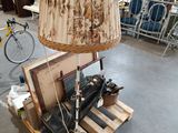 a lamp that is sitting on a pallet in a room