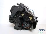 a close up of a car engine on a white surface